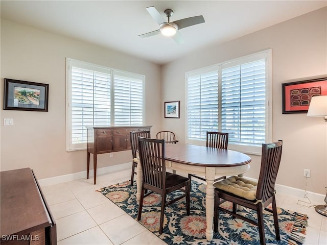 dining area featuring a wealth of natural light, ceiling fan, and light tile patterned floors