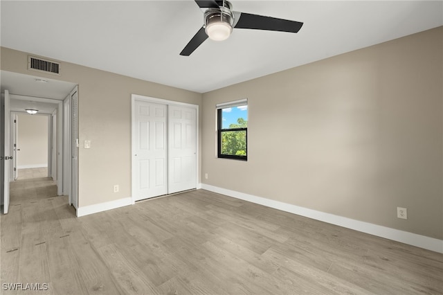 unfurnished bedroom featuring ceiling fan and light hardwood / wood-style flooring