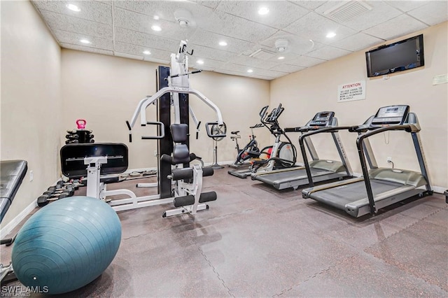 gym featuring a drop ceiling