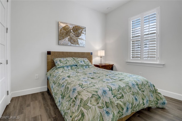 bedroom featuring dark hardwood / wood-style flooring