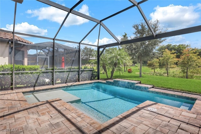 view of swimming pool featuring a lawn, a lanai, and a patio area