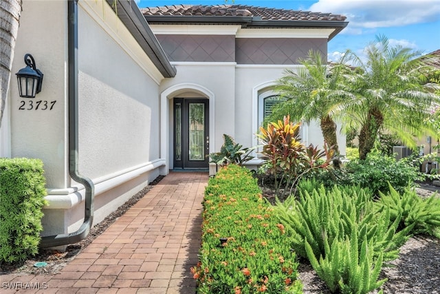 property entrance with central AC unit