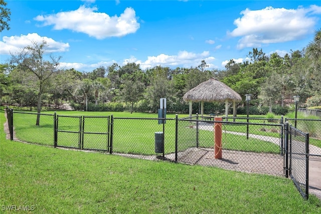 view of home's community with a lawn and a gazebo