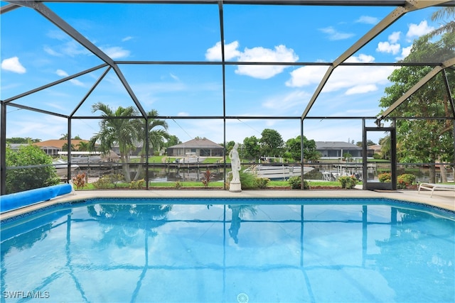 view of pool featuring a lanai