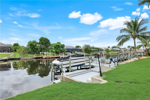 view of dock featuring a lawn and a water view