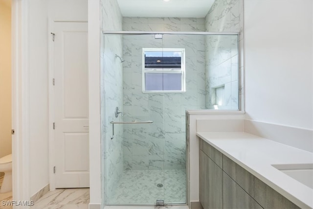 bathroom with toilet, an enclosed shower, and vanity