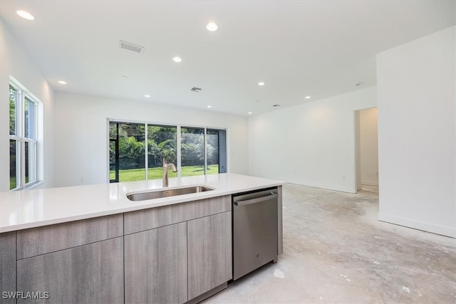 kitchen with stainless steel dishwasher, sink, and a healthy amount of sunlight