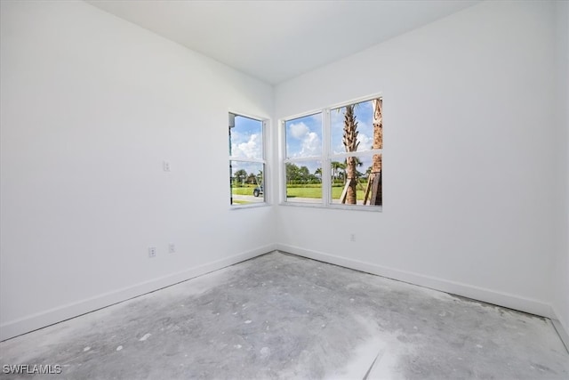 spare room featuring concrete floors