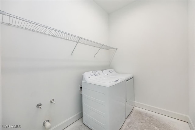 clothes washing area featuring washing machine and clothes dryer