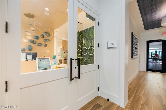 entryway with light hardwood / wood-style flooring and a wealth of natural light