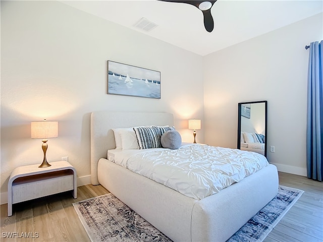 bedroom featuring ceiling fan and hardwood / wood-style flooring