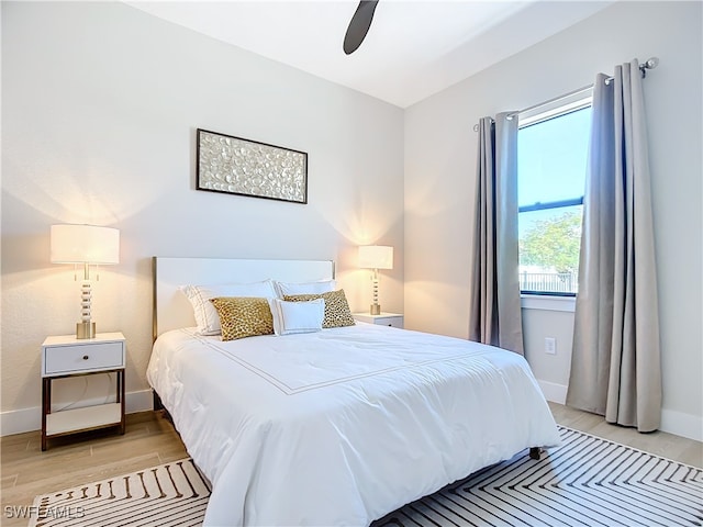 bedroom featuring light wood-type flooring and ceiling fan