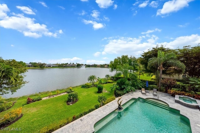 view of pool with a water view, a lawn, and an in ground hot tub