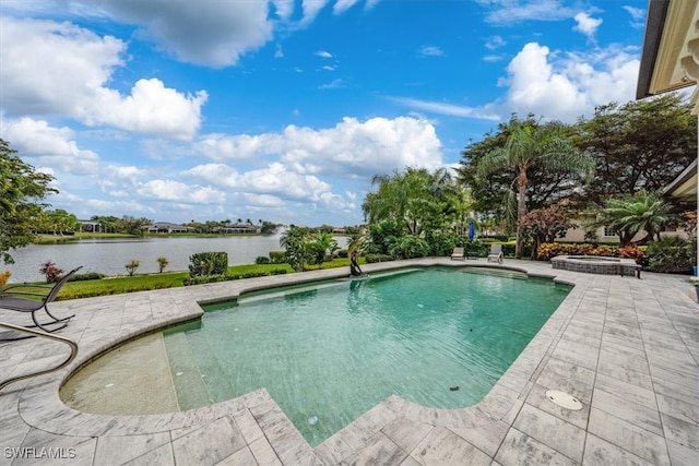 view of pool featuring a patio and a water view