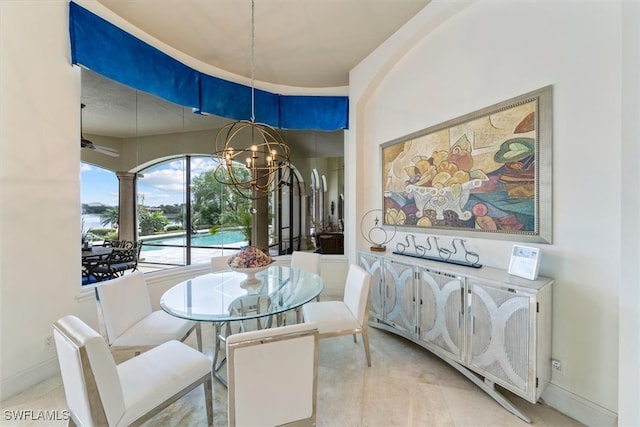 dining space with a chandelier