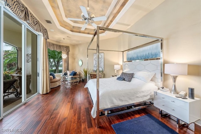 bedroom featuring ceiling fan, dark hardwood / wood-style floors, and access to outside