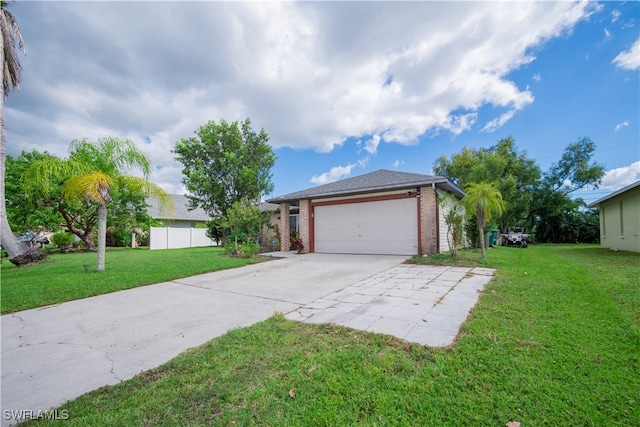 exterior space with a front lawn and a garage