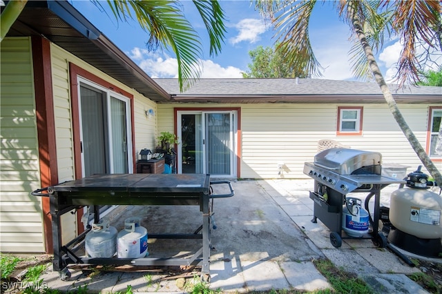 rear view of property featuring a patio area