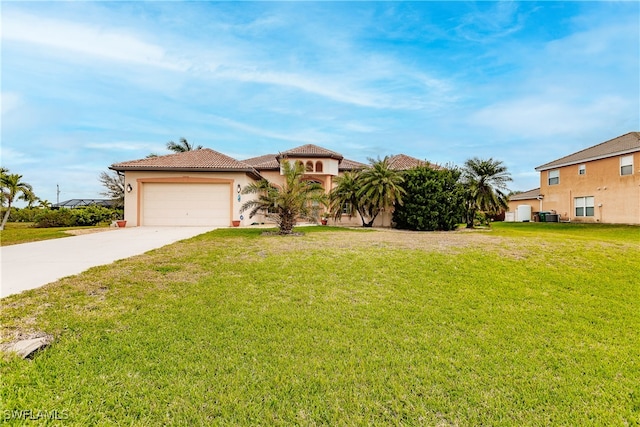 view of front of property with a garage and a front lawn