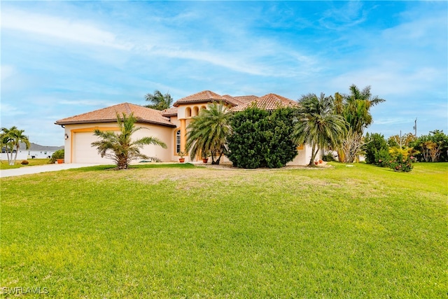 view of front facade featuring a garage and a front lawn