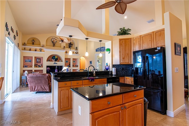 kitchen with a center island, black appliances, built in features, tasteful backsplash, and decorative light fixtures