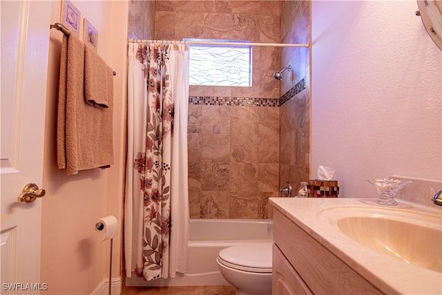 full bathroom with vanity, shower / bath combination with curtain, and toilet