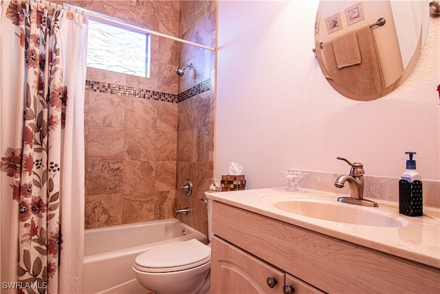 full bathroom featuring shower / bath combination with curtain, vanity, and toilet