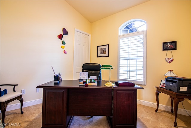 office space featuring lofted ceiling