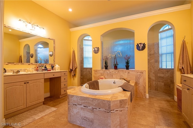 bathroom with tile patterned flooring, ornamental molding, vanity, and a healthy amount of sunlight