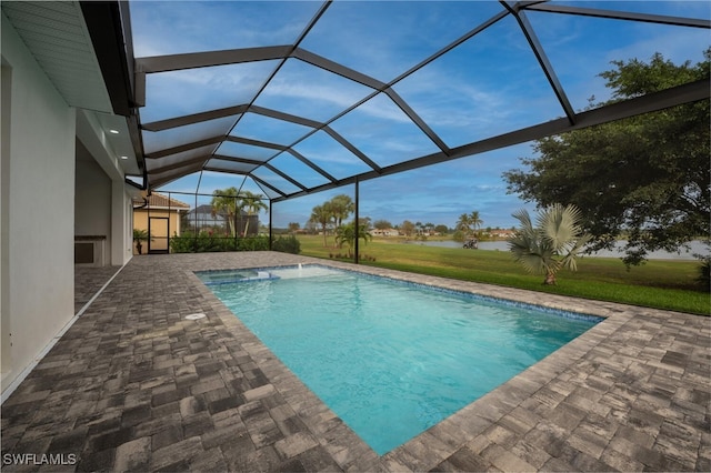 view of pool featuring a lanai, a yard, and a patio