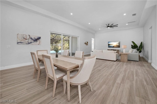 dining space featuring ceiling fan and light hardwood / wood-style flooring