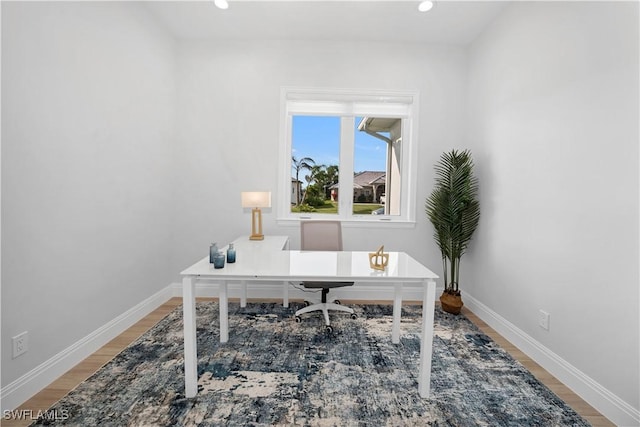 office area with hardwood / wood-style floors