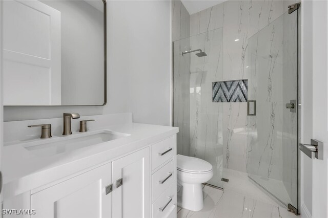 bathroom with vanity, toilet, and walk in shower