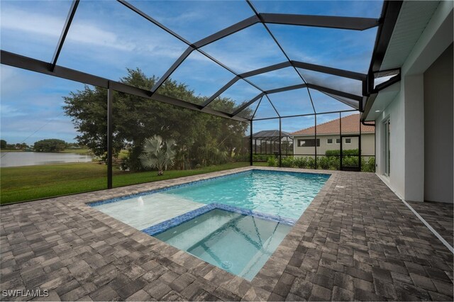 view of swimming pool featuring an in ground hot tub, a patio area, a lanai, and a lawn