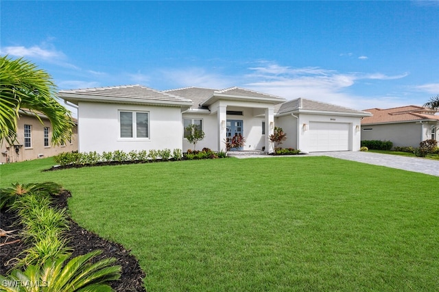 view of front facade featuring a garage and a front lawn