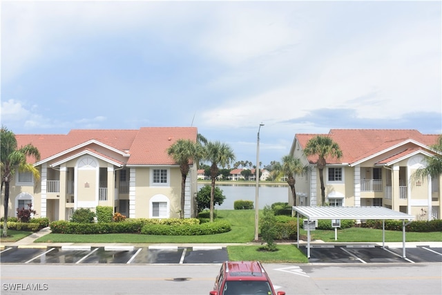 view of building exterior with a water view