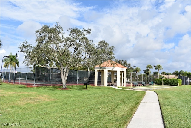 view of property's community with a gazebo and a yard