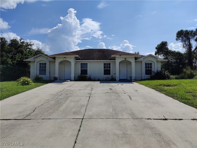 ranch-style house with a front yard