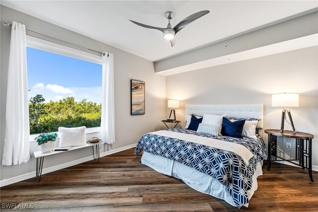 bedroom with ceiling fan and dark hardwood / wood-style flooring