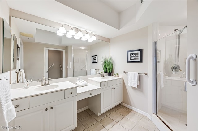 bathroom featuring tile patterned floors, vanity, and walk in shower