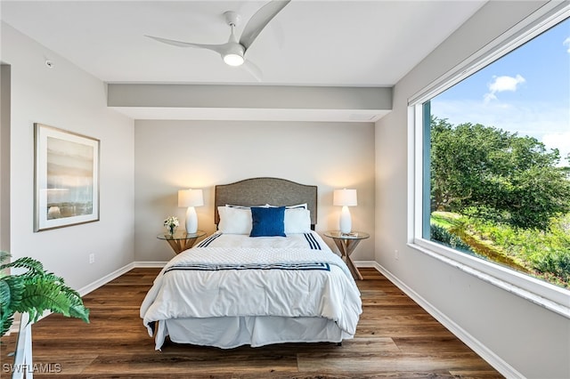 bedroom featuring multiple windows, ceiling fan, and dark hardwood / wood-style floors