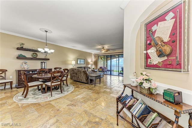 dining area with ceiling fan with notable chandelier and crown molding