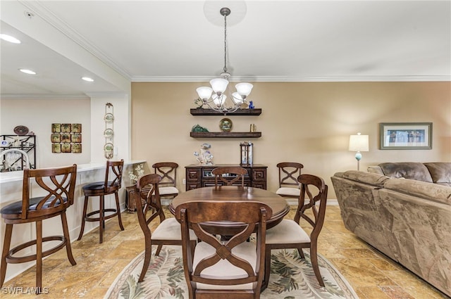 dining room featuring ornamental molding and a chandelier