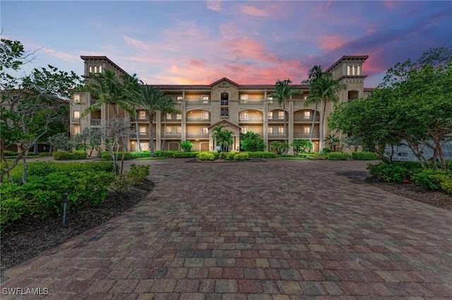 view of outdoor building at dusk