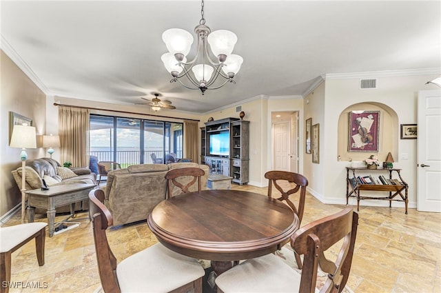 dining space with ceiling fan with notable chandelier and ornamental molding