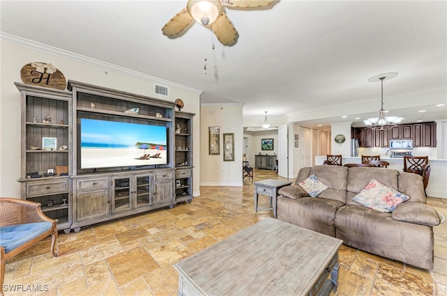 living room featuring ceiling fan with notable chandelier and crown molding