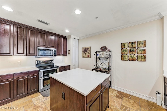 kitchen featuring a kitchen island, stainless steel appliances, dark brown cabinetry, crown molding, and light stone countertops