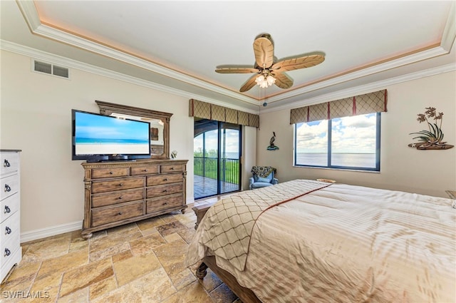 bedroom featuring ornamental molding, ceiling fan, a raised ceiling, and access to outside