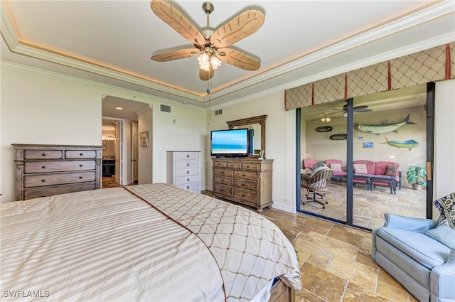 bedroom with ornamental molding, ceiling fan, and a raised ceiling