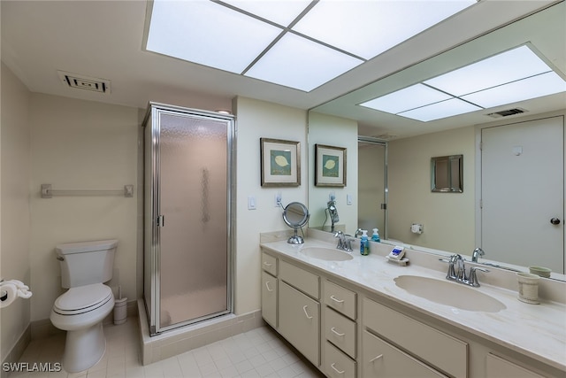 bathroom featuring walk in shower, vanity, toilet, and tile patterned floors